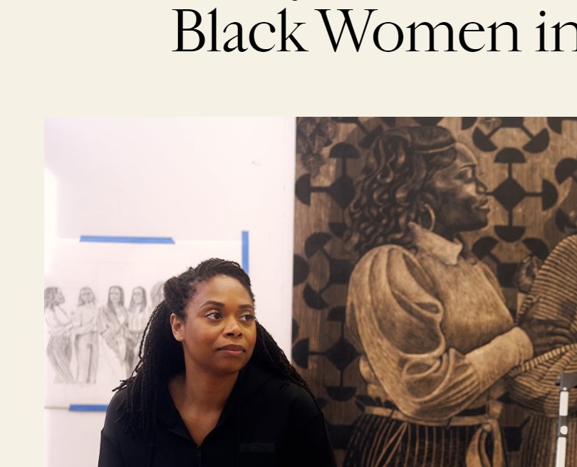 LaToya M. Hobbs with one of her large format woodcuts featuring Black women